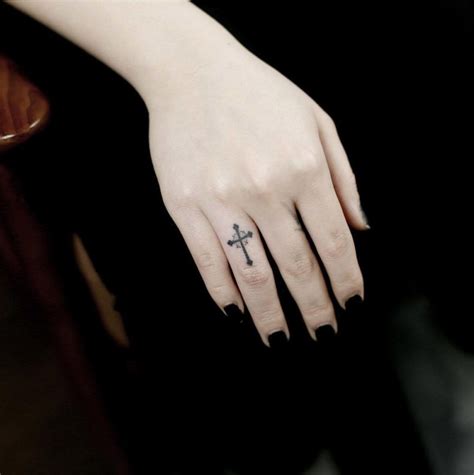 Infinity and cross finger tattoos. A cross by Doy | Cool finger tattoos, Finger tattoos, Tattoos