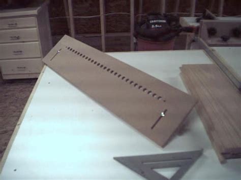 You can cut your shelf drilling jig the same size as your cabinet sides, mark and drill all your shelf pin holes before you even assemble or drill them after assembly. diy shelf pin jig - Google zoeken