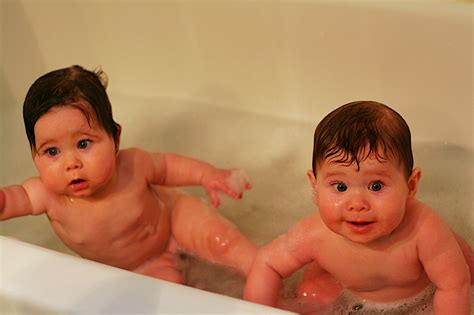 Making sure to support baby's head at all times, gently lower your little one into the water. Life Of The Lorigans » Blog Archive » First Bath Together