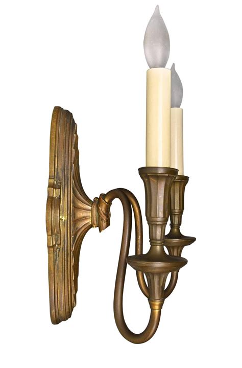 Solid brass ornate candle holder wall sconce with serpent tail made in india. Federal Style Cast Brass Two Candle Sconce For Sale at 1stdibs
