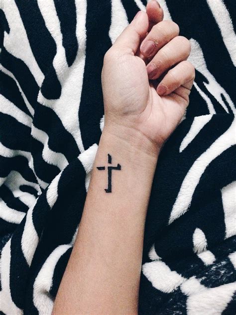 You can give it a unique turn by trying the cross tattoo design on the side of the wrist like this. Pin on Tiny tattoos