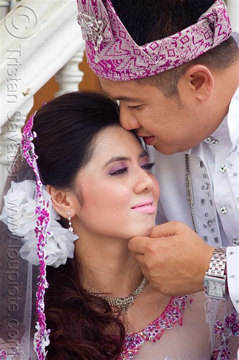 Contextual translation of shipped out into malay. couple kissing, malay wedding, kuching, borneo