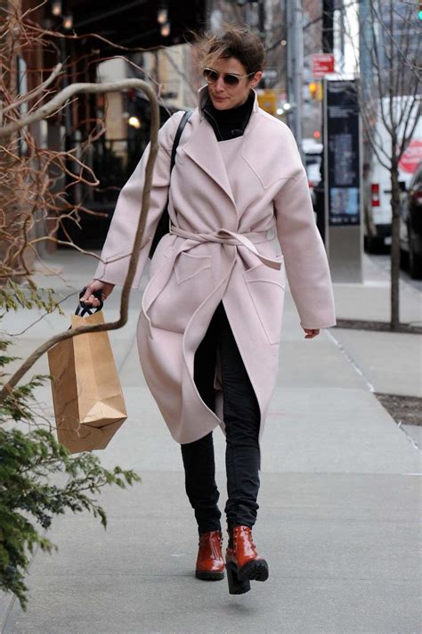 Cast memories with julianne hough and cobie smulders. cobie smulders wears a soft pink trench coat as she steps ...