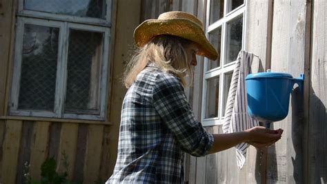 , feeding my farm animals. Gardener Girl Woman Wash Hands Under Rural Plastic Hand ...