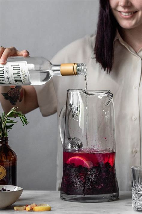 Hosting a cocktail party and out to impress? Blueberry Lemon Vodka Spritz • Serendipity by Sara Lynn | Recipe | Lemon vodka, Pitcher ...