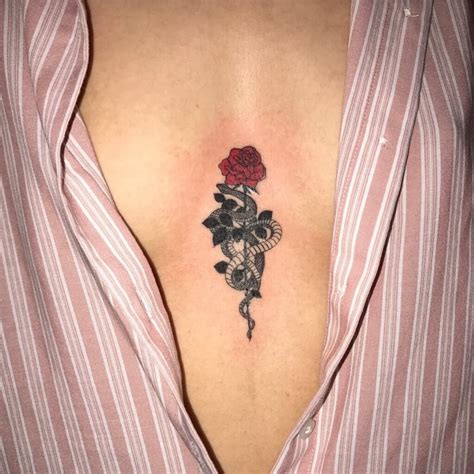 The biggest rose rests at the center while two smaller flowers sit on either side to form a chain. 50+ Cool Snake Tattoo Ideas Who Love Elongated Lines