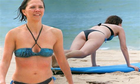 Maybe you would like to learn more about one of these? Maggie Gyllenhaal shows off her bikini body as she does ...