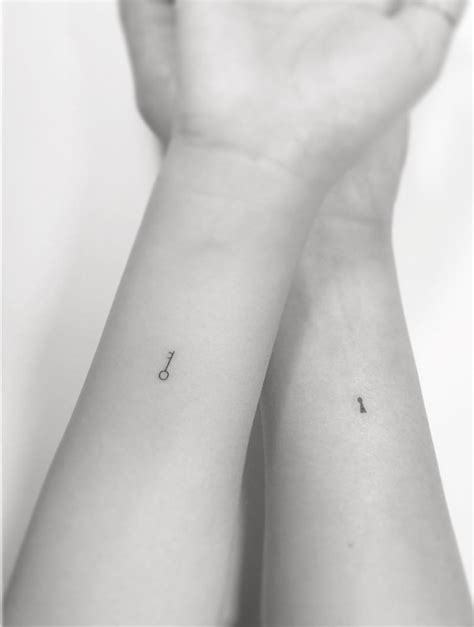 Small lock and key couple tattoos on hand and wrist. 32 Small Tattoo Ideas for Women | Crestfox