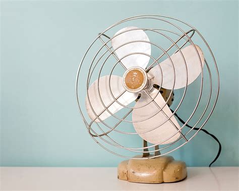 Tabletop oscillating fans sit on desks, countertops, and work tables to provide a custom height for the fan's air flow. Vintage Metal Fan, Yellow Wizard Western Auto Metal ...