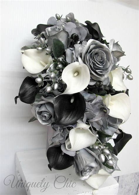 Black tie wedding white wedding flowers floral wedding wedding bouquets ranunculus bouquet blue bouquet spring wedding colors this black tie night at the museum wedding is truly a marriage to remember. Cascading bouquet, Silver rose Black and White Calla lily ...