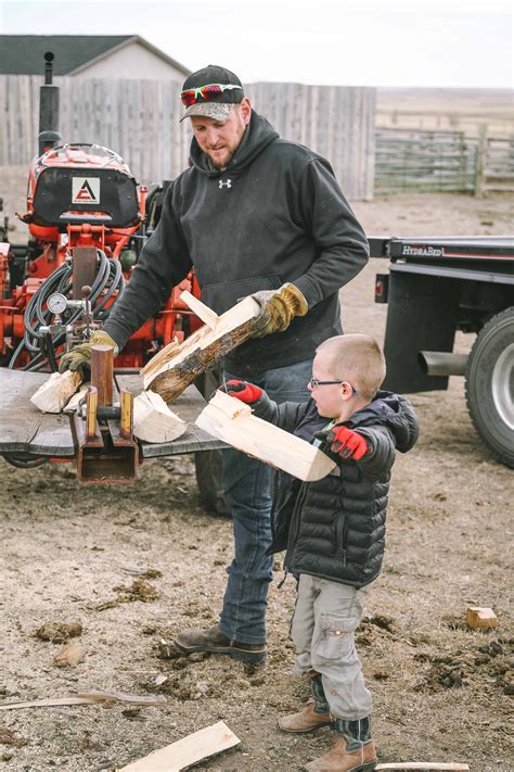 Then, place a piece of wood on either side of the log to act as supports so the log doesn't roll left or right. cutting-firewood-1 • The Prairie Homestead