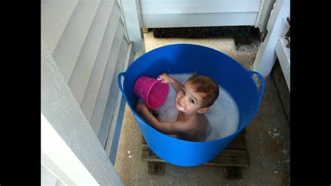 How do you bathe a toddler or baby in a shower? TubTrugs | How to Give Your Baby a Bath in a Shower Stall ...