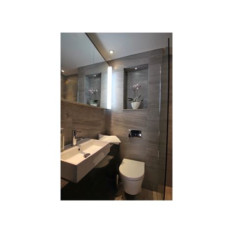 A fog free mirror will help maintain that. Small En Suite Shower room - STONEWOOD