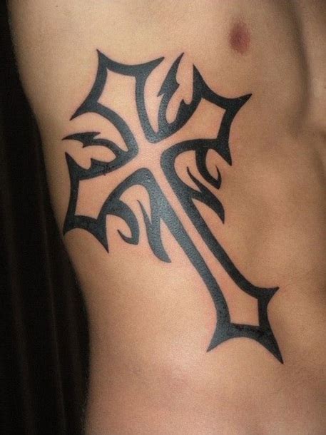A tribal cross tattoo is a bold statement that blends religion and heritage. Celtic Cross Tattoo for Men Tattoo Idea
