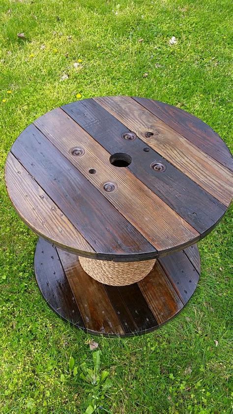 Wire spools of various sizes. Wooden wire spool table! The table is stained, coated with ...