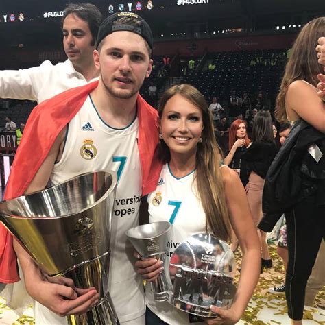 The guy who is having fun but clearly has no business being there and wants to leave asap. Luka Doncic's Mom is Hot!!! - RealGM