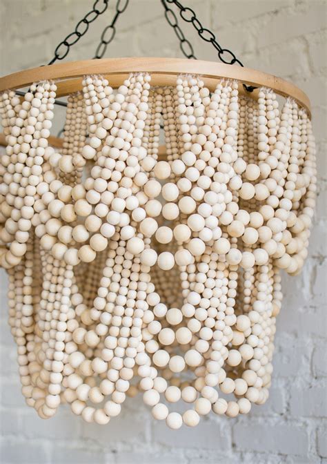 Amazing gallery of interior design and decorating ideas of wood beaded chandelier in living rooms, decks/patios, dining rooms. DIY Bead Chandelier - The House That Lars Built