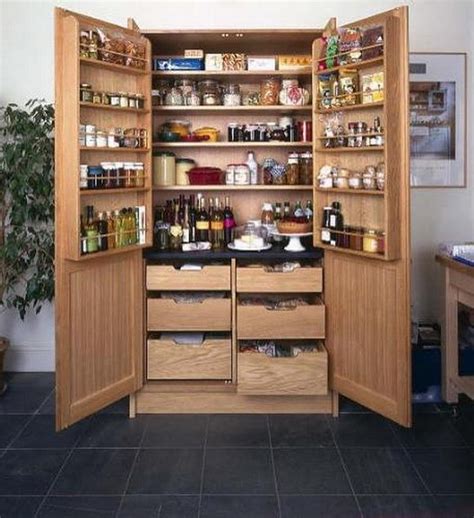 Oak pantry storage cabinet with shelves and drawers. Pantry Cabinet Ideas | The Owner-Builder Network