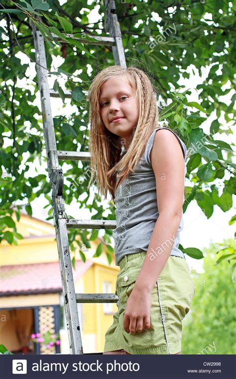 Claro, the figure is really high in a category like this. A 12 years old girl in the garden Stock Photo, Royalty ...