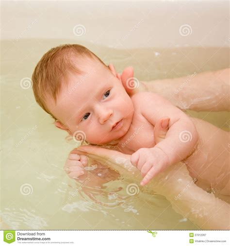 Bath seats are a great option for babies newly transitioning to the regular tub. Newborn Baby Bathing Royalty Free Stock Photography ...