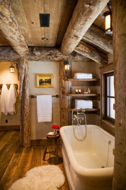 Heidi long / see more of this montana cabin here. The bathroom is complete with wooden timbers and a western ...