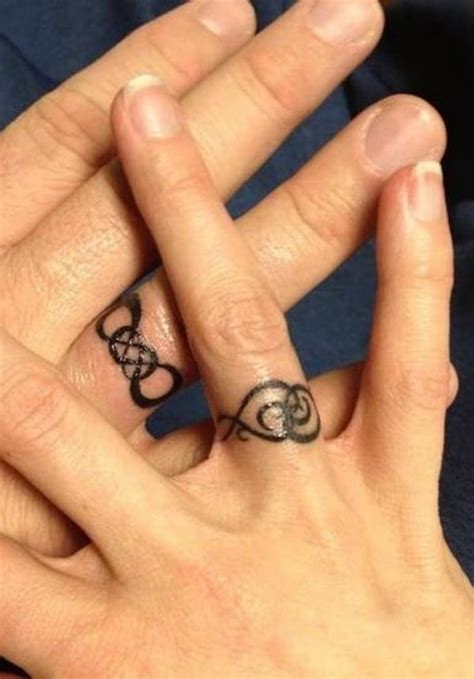 Little tattoos gave us some great ideas for wedding band tattoos. 20 Magnificent Wedding Ring Tattoos Ideas - SheIdeas