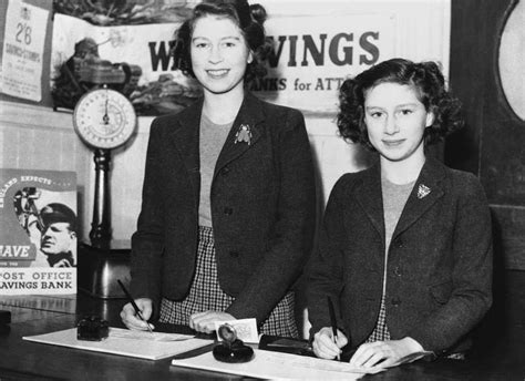 11. Princess Elizabeth (L) and Princess Margaret Rose photographed as they sign their savings ...