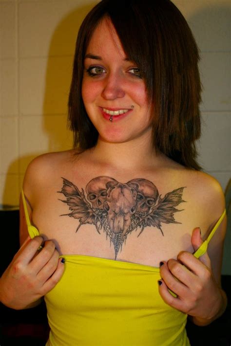 Another chest tattoo over the heart sybolizing the relationship between the beating heart and the tick of a clock. Beautiful Chest Piece Tattoo Designs For Girls Elegant ...