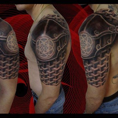 Cross and chainmaille 3d tattoo. Really like this shoulder armor tattoo! Not so much on the ...