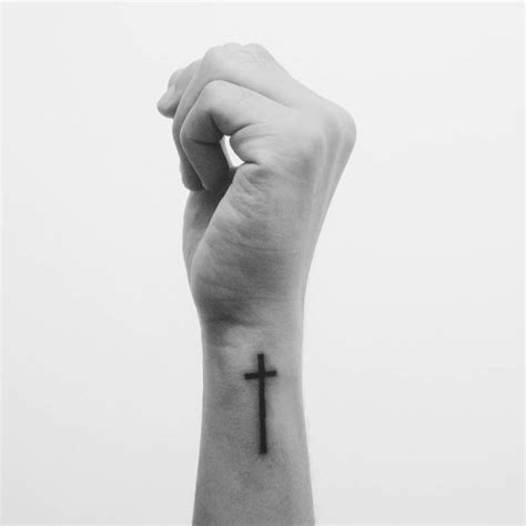 A cross tattoo worn on the wrist was a particular element of the copts. Christian cross on Jordan Halili's wrist.