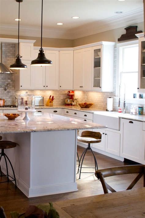 The white shaker is a highly popular choice for kitchens; White Kitchen Cabinets With Black Hardware | Countertopsnews