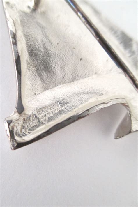 Matti Hyvarinen textured silver brooch | Silver earrings aesthetic, Silver brooch, Silver