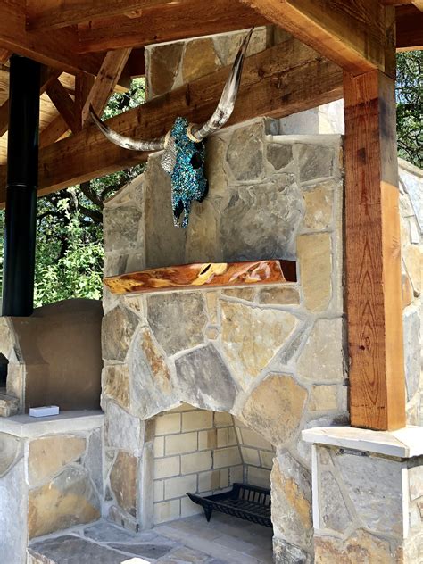 Maybe you would like to learn more about one of these? Outdoor fireplace with flagstone. Decorated Texas longhorn ...