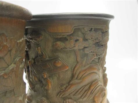 We did not find results for: Two Chinese bamboo brush pots, one carved with lotus flowers, the others with figures (2) in ...