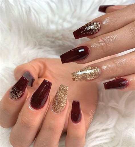 And rhinestones will instantly glam up your nails. So cute coffin shaped maroon nails with gold glitter ...