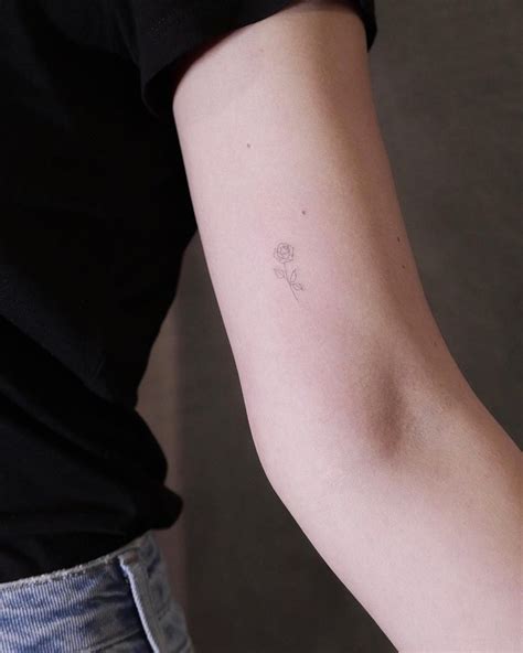 8 tiny rose tattoos you'll love forever. Super tiny rose tattoo by Jakub Nowicz - Tattoogrid.net