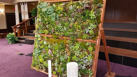 Creating a vertical wall garden with recycled materials. 7ft x 7ft Freestanding Succulent Wall for a backdrop for a ...