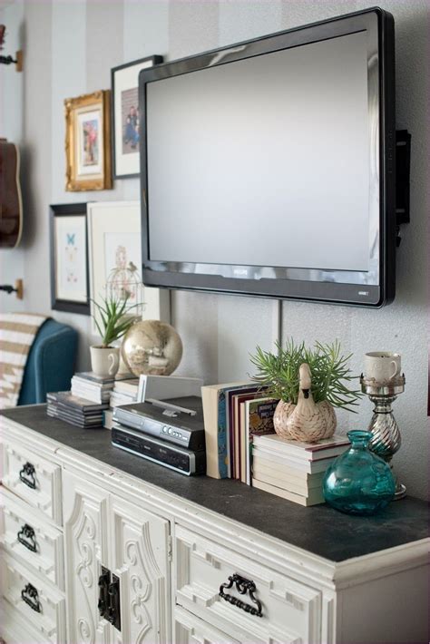 When mapping out your gallery wall decor, think of the tv's frame as the first part of the design and surround it with wall art accordingly. gallery wall above dresser 16 (With images) | Living room tv wall, Wall decor bedroom, Decor ...