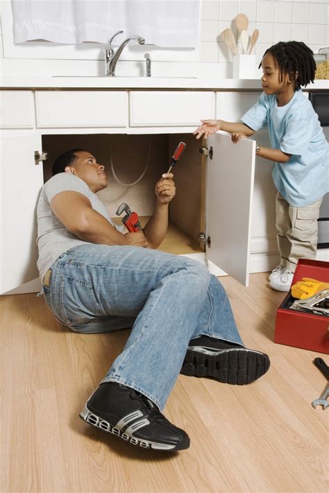 Roll up a snake shape in your hands. How to Close Openings Around Pipes Under a Kitchen Sink ...