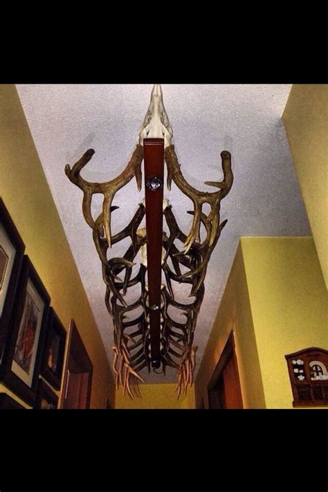 Maybe you would like to learn more about one of these? Great light fixture idea for log cabin or hunting lodge ...