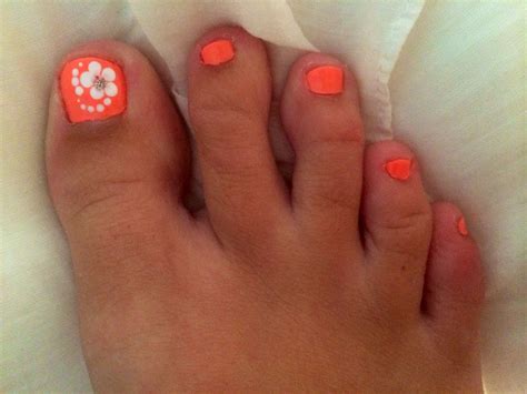 This one mixes in a bit of the french pedicure idea and adds a white horizontal stripe, as well as some flowery accent. hawaiian style nails. aloha! | Flower toe nails, Toe nail ...