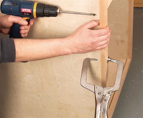 Attach the base plate to the base of the cabinet, using the predrilled holes and the short screws. AW Extra 7/5/12 - Tips for Building Cabinets with Pocket-Hole Joinery | Popular Woodworking Magazine