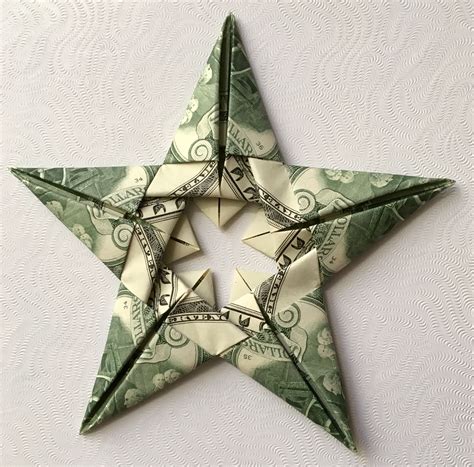 Learn how to fold a quick and simple origami paper star. Creative Image of Origami Money Star - craftora.info
