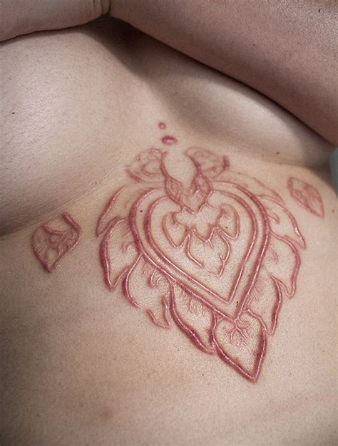 So people find body modification experts or piercers with a bit too much ambition. Tricks And Treats | Scarification tattoo, Scarification ...