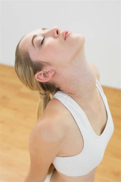 Here are morning stretches that you can rotate for a. Lovely Toned Woman Doing Yoga Pose For Stretching Her Body ...