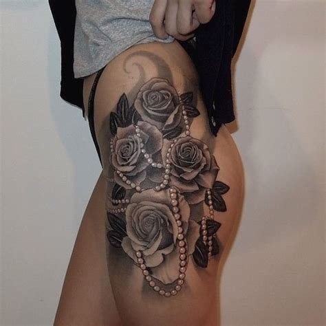 Roses can be seen in all different colors from red to yellow. Roses with Beads Thigh Tattoo | Amazing Tattoo Ideas