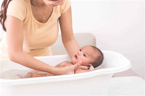 Baby is bathed in light bathroom. Detox Baths for Babies: How to Give Your Child a Detox Bath
