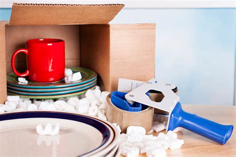 Many cardboard boxes have parts that are glued together, so reinforcing these parts can increase for additional strength and support, you can also tape the outer joints and edges and tape across all. Moving Dishes Cups Packed Inside Cardboard Box Packing ...