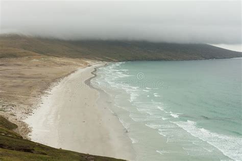 It is run as a sheep farm and has an area of 132 km². Saunders Island Beach Under A Bank Of Clouds Stock Image ...