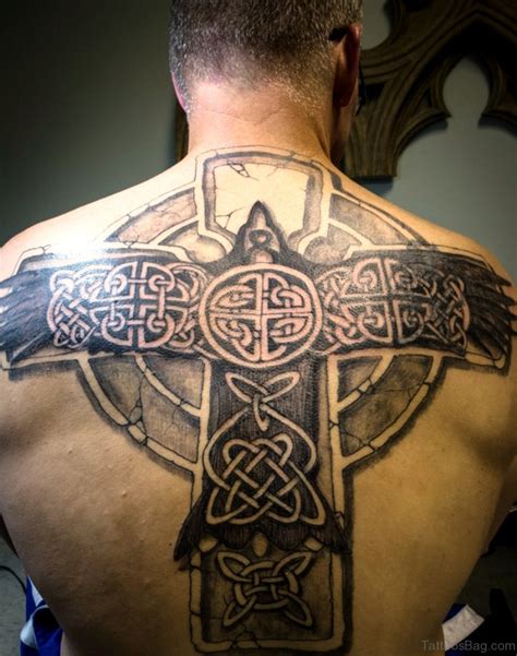 A small celtic cross tattoo placed on the upper part of the back. 100 Outstanding Celtic Tattoos For Back